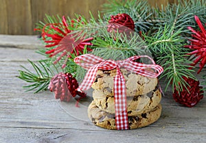 Christmas cookies with ribbon and green fir