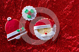 Christmas cookies Santa face and Xmas bell on red background