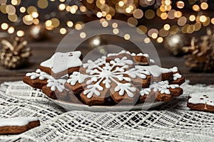 Christmas cookies in the shape of snowflakes and stars on a plate