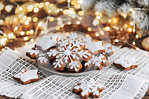 Christmas cookies in the shape of snowflakes and stars on a plate