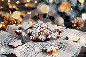 Christmas cookies in the shape of snowflakes and stars on a plate