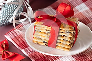 Christmas cookies, tied with a red ribbon