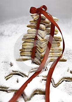 Christmas cookies tied by red ribbon