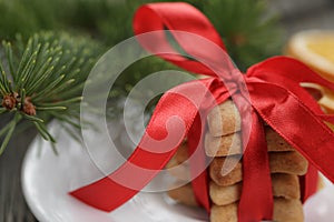 Christmas cookies tied with red ribbon