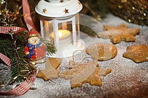 Christmas cookies on wooden background with powdered sugar