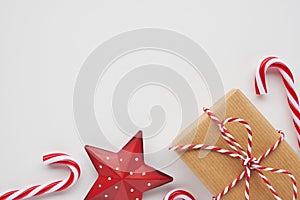 Christmas corner border with gift, candies and ornament on white background