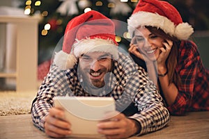 Christmas couple buying on net for holiday