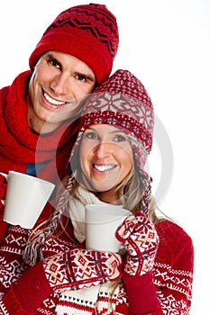 Christmas couple drinking hot tea.