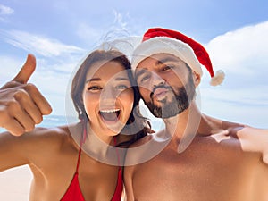 Christmas Couple Selfie photo During Tropical Beach Vacation at Winter