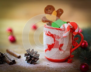 Christmas Cup ornament and a fun gingerbread on a wooden table