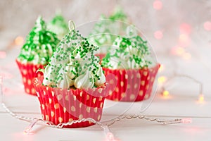 Christmas cupcakes with christmas tree shape, sparkler and lights