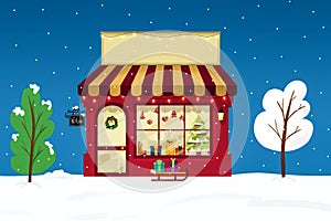 Christmas cute shop exterior view, on winter snowing background.