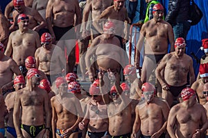 CHRISTMAS DAY HARBOUR SWIM 2015, BARCELONA, Port Vell - 25th December: Swimmers in Santa Claus hats prepared for contest