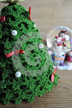 Christmas decor of a ball and crocheted fir-tree