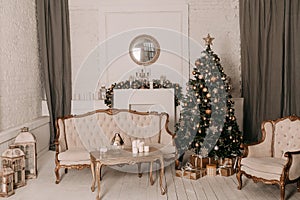 Christmas decor. Christmas tree decorations and holiday homes. New Year`s interior with a fir tree in white tones