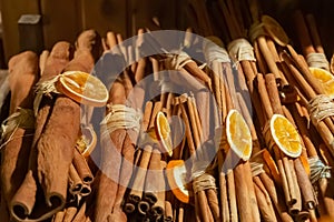 Christmas decor cinnamon sticks and orange, culinary background
