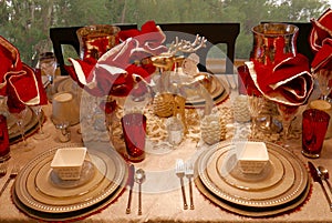 Christmas decor elegant dining table setting in red, gold, and silver