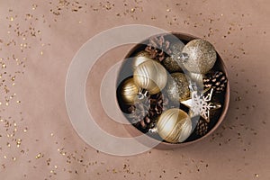 Christmas decor shiny balls, pine cones in a box