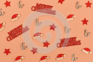 Christmas decoraion in shape of stars, santa hats and text ornaments saying Merry Christmas and ho ho ho