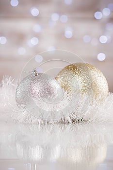 Christmas decorated balls and tinsel with bokeh background