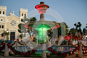 Christmas decorated fountain in front of a church in the Guayama, Puerto Rico town square
