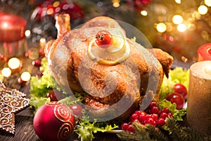 Christmas. Decorated holiday table with roasted chicken