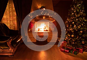 Christmas decorated tree in dark interior with fireplace, armchair, and window