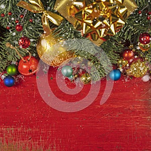 Christmas decorating elements and ornament on rustic red wood table