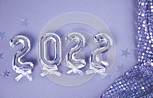 Christmas decoration with 2022 numbers in new pontone color very peri. Top view.