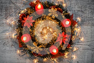 Christmas decoration. Advent wreath on wooden background with ca