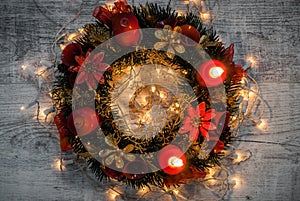 Christmas decoration. Advent wreath on wooden background with ca