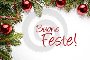 Christmas decoration background with holiday greeting in Italian `Buone Feste`!