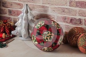 Christmas decoration ball sewn from pieces of fabrics, sewing accessories, traditional patchwork