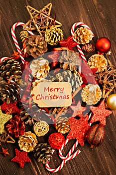 Christmas decoration, balls, fir cones, candies and red stars