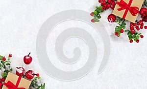 Christmas decoration, banner. Gift box with red ribbon, bow, twigs christmas tree, red berries and apples on snow