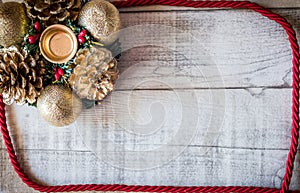 Christmas decoration banner on wooden background, candle holder, with space for text.