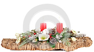 Christmas decoration with bark and red candles on white background