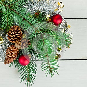 Christmas decoration baubles with branches of fir tree on white background