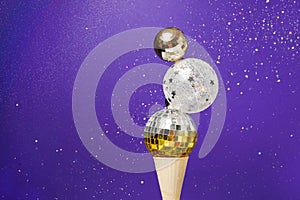 Christmas decoration baubles in ice cream cone on veri peri magic background. winter New Year card