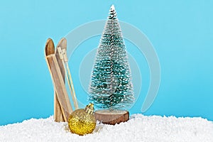 Christmas decoration on blue background. Christmas tree, Christmas ball and skis on blue background