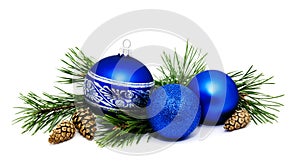 Christmas decoration blue balls with fir cones and fir tree branches isolated