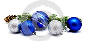 Christmas decoration blue and silver balls with fir cones and fir tree branches isolated on a white