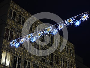 Christmas decoration at building in German city by night photo