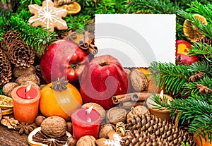 Christmas decoration burning candles greetings card Apples tangerine photo