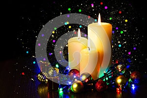 Christmas decoration with candles over dark background with bokeh light