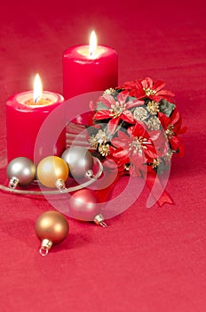 Christmas decoration with candles ribbons and cookies