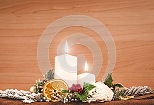 Christmas decoration with candles on wooden background