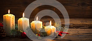 Christmas decoration with candles on the wooden table