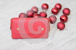 Christmas decoration and celebration. Xmas red balls. New Year preparations. White background. New Year concept with gift bag.