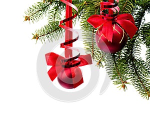 Christmas decoration. Christmas tree with hanging red balls with red bow on white background with space for text